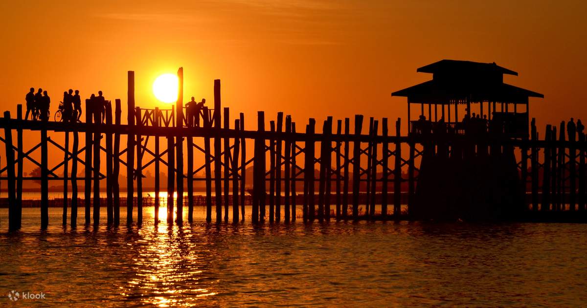 Watch the sunset over U Bein Bridge, Amarapura, near Mandalay