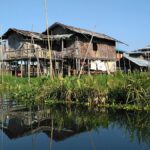 Explore the floating villages and gardens of Inle Lake by riverboat, Shan State