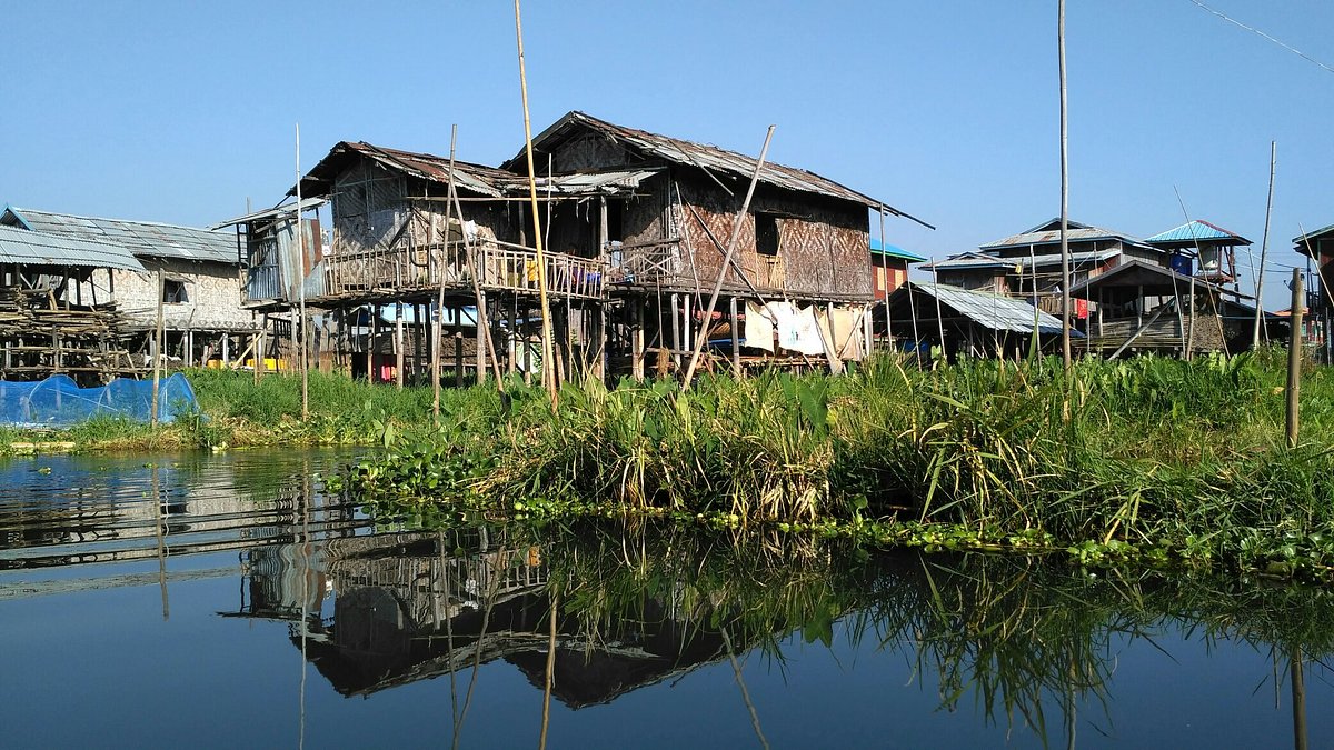 Explore the floating villages and gardens of Inle Lake by riverboat, Shan State