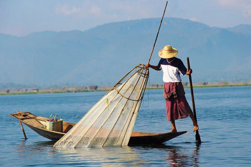 Explore the floating villages and gardens of Inle Lake by riverboat, Shan State